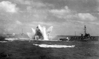 The USS Chatelain, DDE 149 salvoing depth charges on the U-505 on June 4,1944.